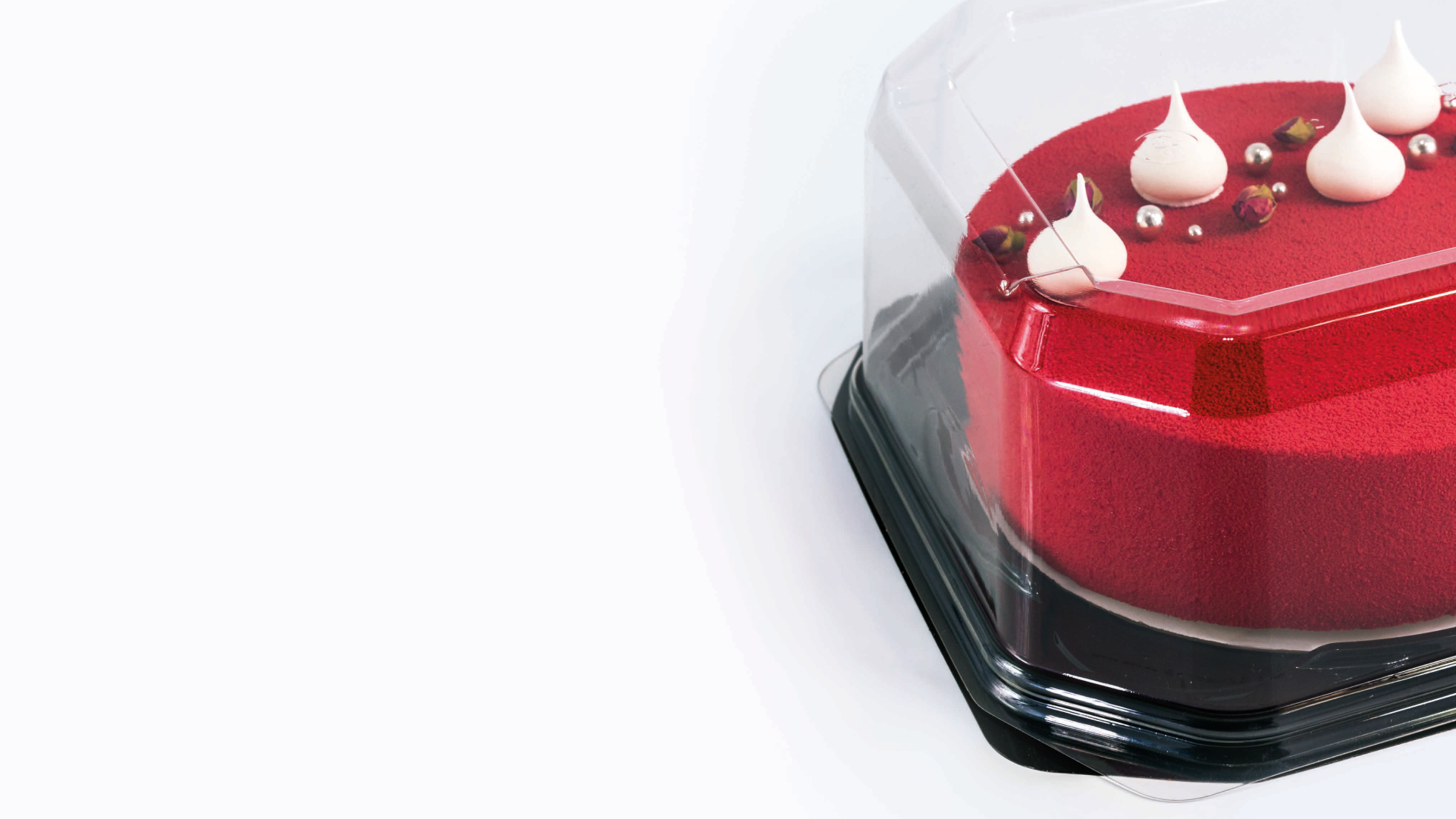 Cake in a clear dome container